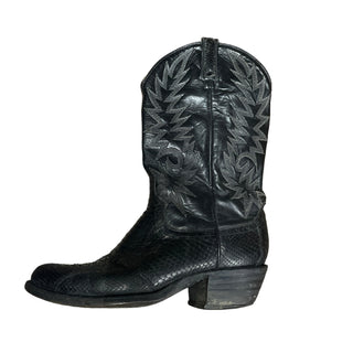 Black leather golf club head cover with intricate design on a wooden surface