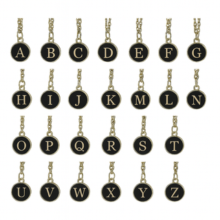 Set of gold necklaces with black round pendants displaying letters A to Z on a white background.