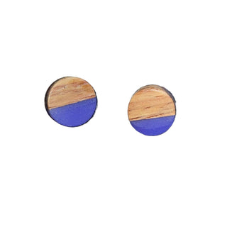 Round wooden earrings with blue on a white background