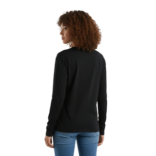 Woman wearing a black long-sleeve shirt and blue jeans on a white background
