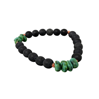 Black beaded bracelet with green accents on a white background