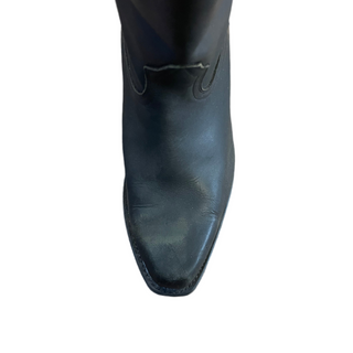 Black leather boot on a white background