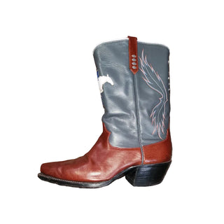 Cowboy boot with gray top and brown bottom on a wooden floor
