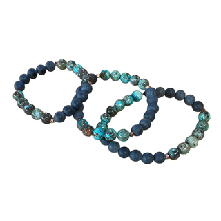 Set of blue beaded bracelets on a white background