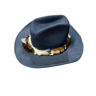 Blue cowboy hat with feathers on a white surface