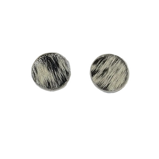 Round earrings with a cowhide textured design on a white background