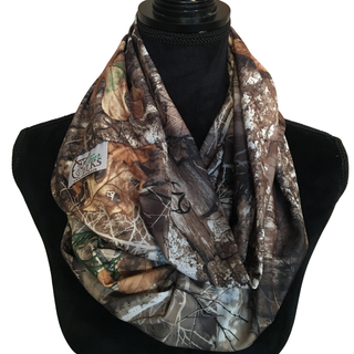 Camouflage patterned infinity scarf on a black mannequin with a white background