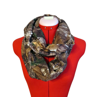 Camouflage patterned infinity scarf on a red mannequin with a white background