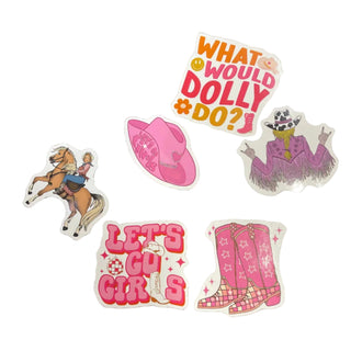 A collection of weatherproof stickers with various designs, including a cowgirl, a boot, and text-based designs, placed on a white surface.