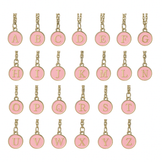 Set of pink letter charms on gold chains against a white background