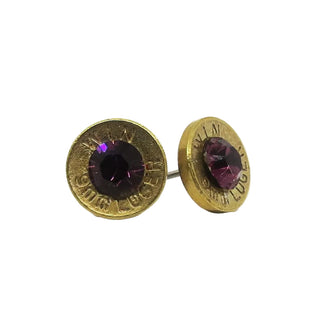 Gold earrings with purple gemstones on a white background