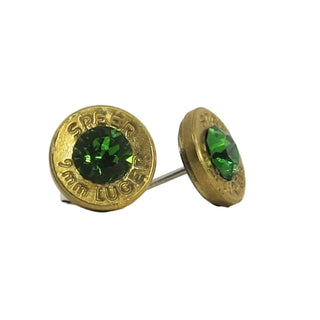 Gold bullet-shaped earrings with green gemstones on a white background