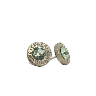 A pair of stud earrings made from recycled bullet casing with peridot gemstones,