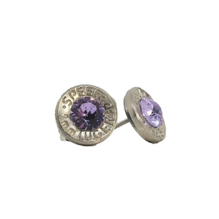 A pair of stud earrings made from recycled bullet casing with an amethyst  gemstone, set against a white background.